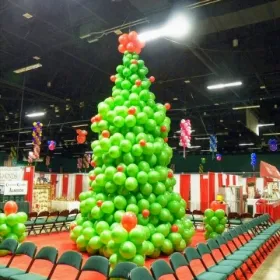 Big christmas tree balloon decorations on an indoor event